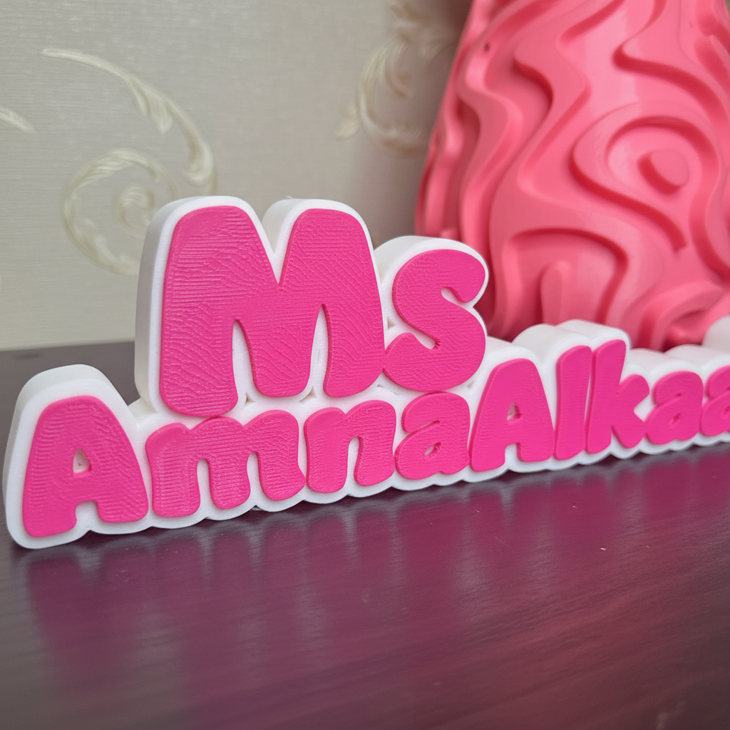 Close-up detail of name sign showing material finish and vibrant pink color